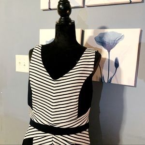 Blue and White strip dress. Size 14 . Gold Zipper in the back . No sleeves .